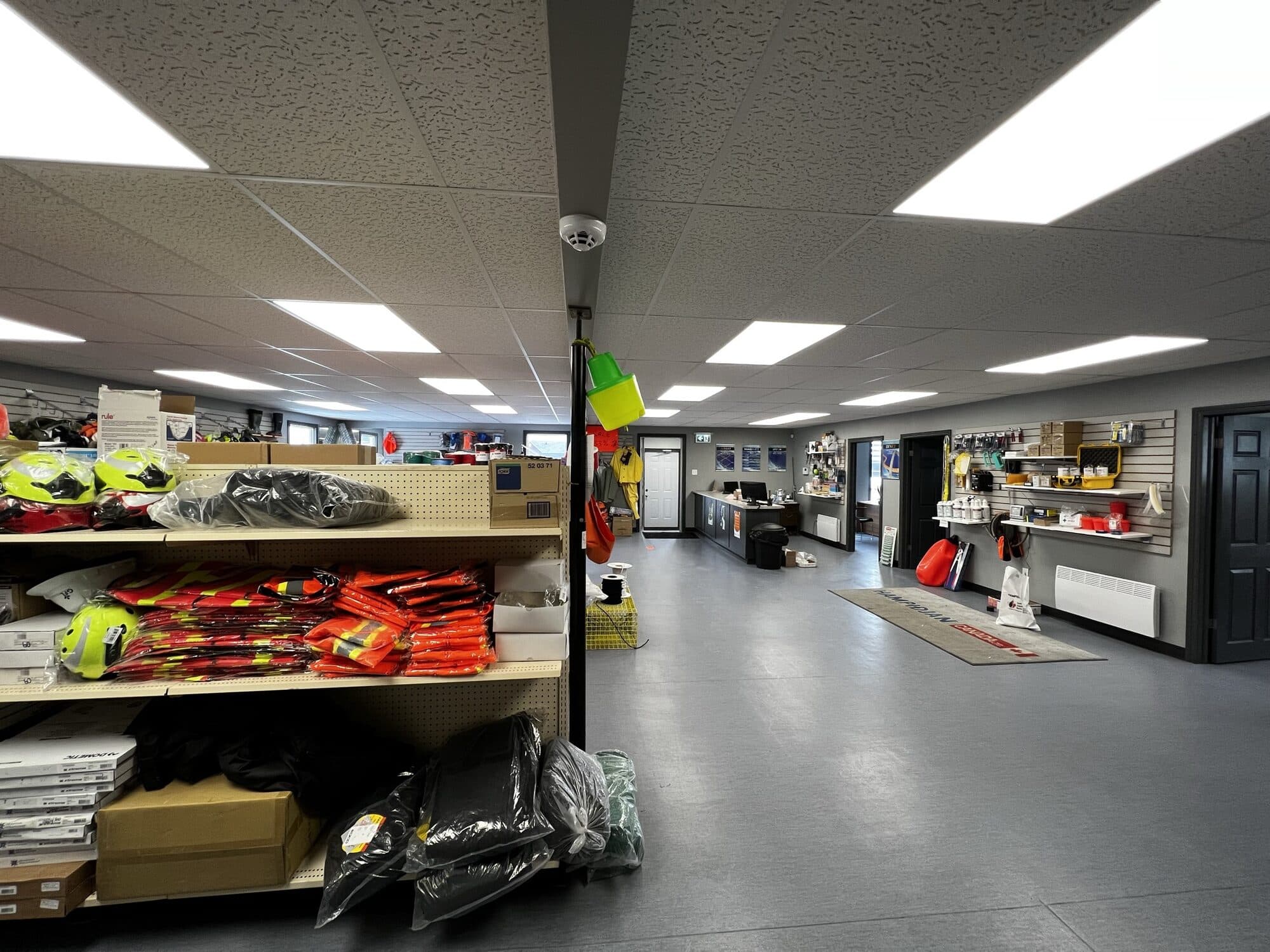 The walk-in counter at a branch, with safety gear and marine supplies shelved along the floor